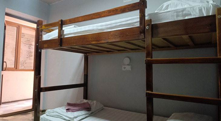 A bed in 4-Bed Mixed Shared Room