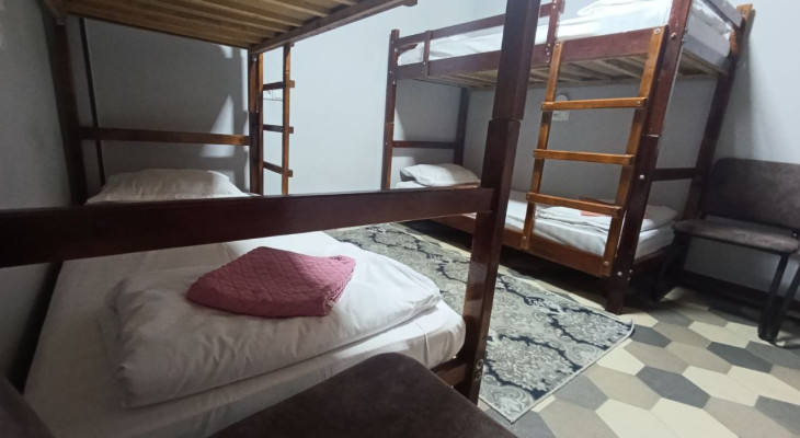 A bed in 4-Bed Mixed Shared Room