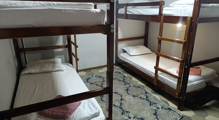 A bed in 4-Bed Mixed Shared Room